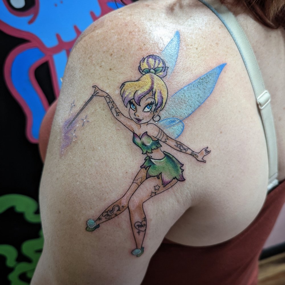 Color fairy tattoo on a shoulder