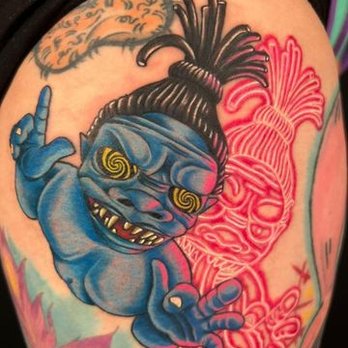 Color tattoo with blue character artwork