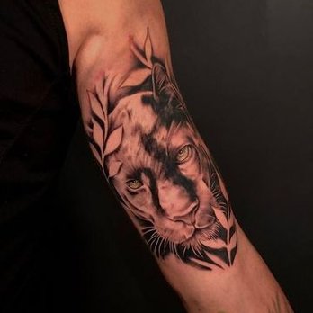 Detailed lion tattoo on a forearm